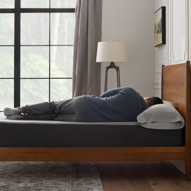 Man laying on side on the Neve Mattress