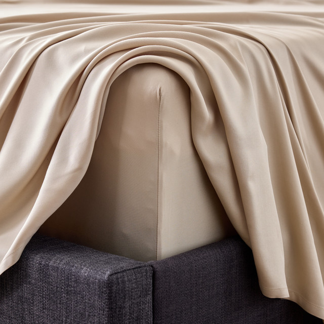 Corner shot of the the Smooth Bamboo Rayon Sheet Set in the color Driftwood