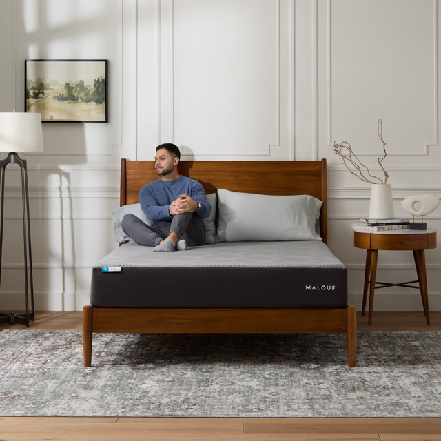 Man sitting on the Neve Mattress