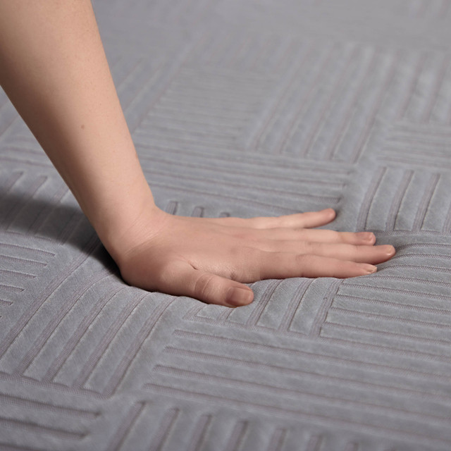 hand pressing into the Polaris Hybrid Mattress