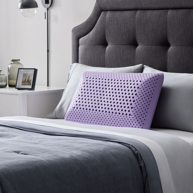 Zoned Dough Pillow in lavender on bed